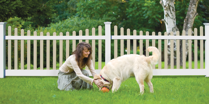 Woman with dog in a backyard